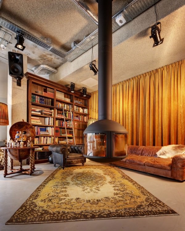 library-bookshelves-persian-rugs-hanging-fire-place