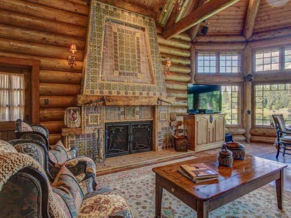 hand-painted-tiles-like-the-ones-above-the-living-room-fireplace-are-a-recurring-design-accent