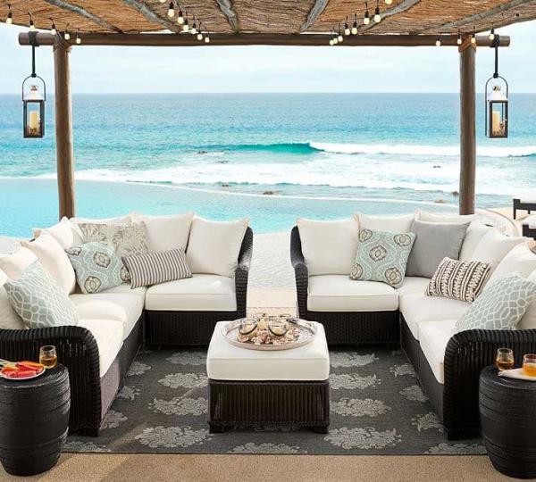 Pottery-Barn-black-wicker-sofa-near-ocean