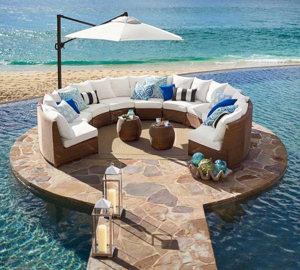 Pottery-Barn-honey-wicker-sectional-on-rounded-platform-next-to-ocean