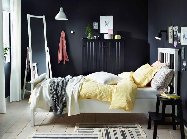 NYPONROS-bed-frame-stands-in-contrast-to-the-dark-backdrop-and-sideboard
