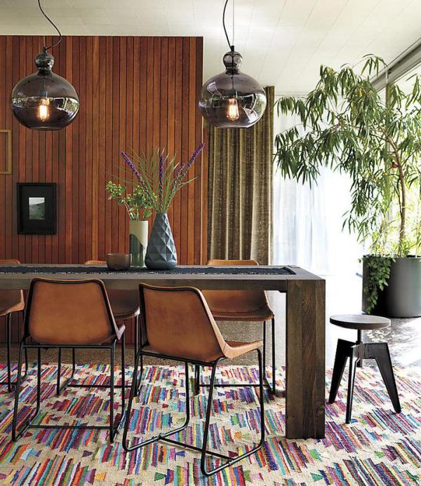 Potted-plants-and-vase-greenery-add-life-to-this-modern-dining-room
