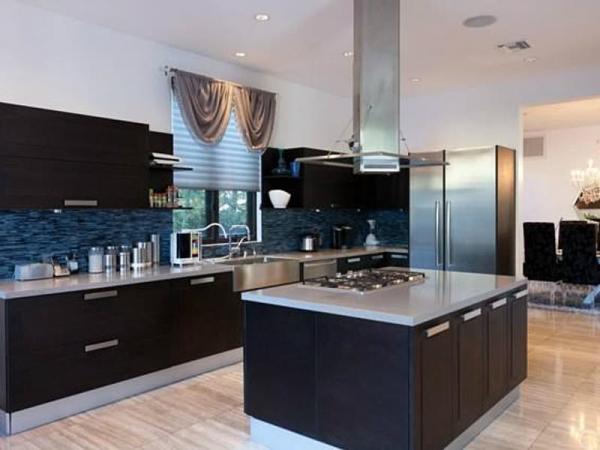 the-kitchen-is-outfitted-with-appliances-by-miele-and-bosch-as-well-as-a-built-in-coffee-bar