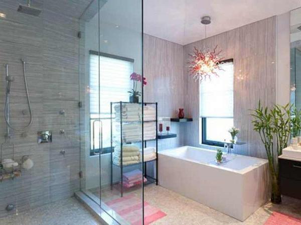 the-master-suite-has-a-balcony-that-overlooks-the-pool-and-a-bathroom-with-a-crazy-light-fixture-that-you-can-stare-at-while-you-soak-in-the-tub