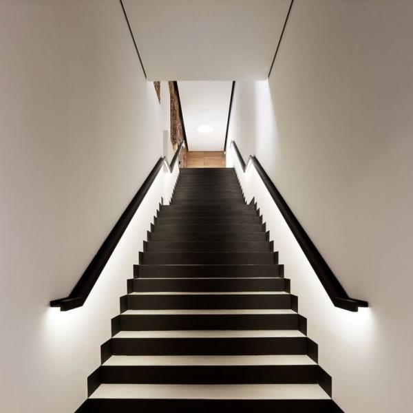 Black-and-white-staircase-with-lighting-along-railings