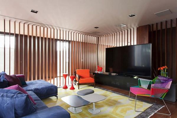 Colorful-TV-room-in-Brazilian-home-is-part-of-a-larger-living-space