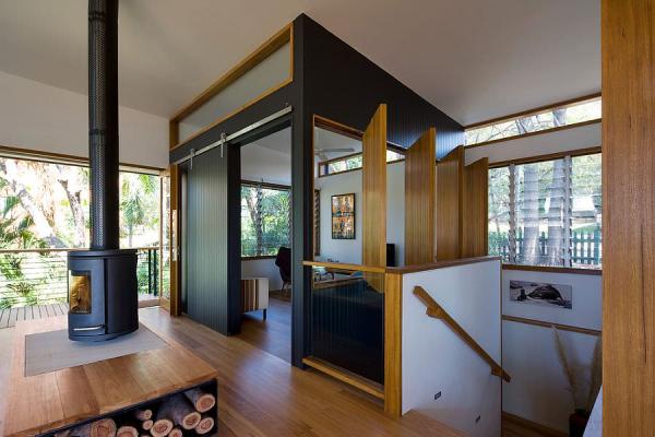 Contemporary-dedicated-TV-room-with-wooden-windows