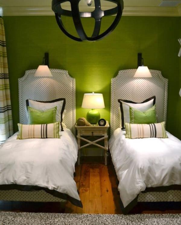 Green-guest-room-with-matching-accent-pillows-for-twin-beds