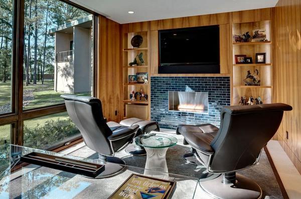 Home-office-with-hidden-TV-above-the-fireplace