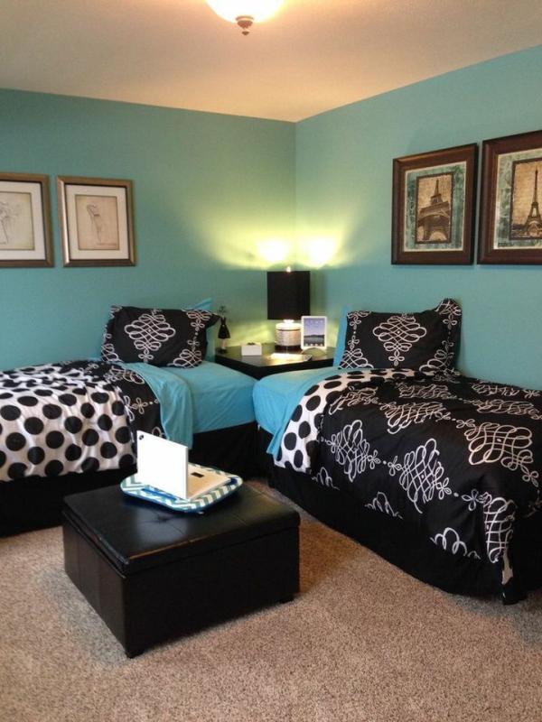 Twin-beds-positioned-up-against-two-different-walls