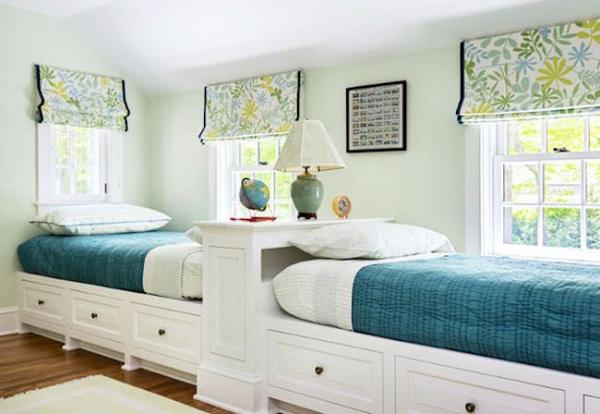 Two-twin-beds-along-one-wall-with-extra-storage