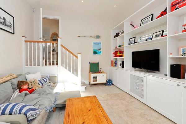 Versatile-TV-room-can-also-serve-as-guest-room-and-kids-study