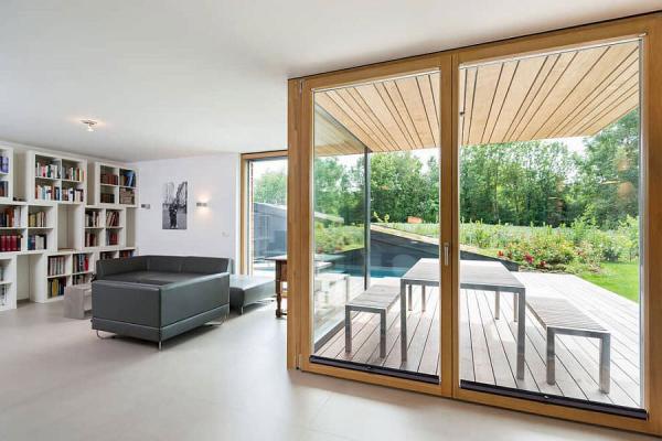 Frame-glass-doors-lead-the-way-from-the-living-room-to-the-backyard