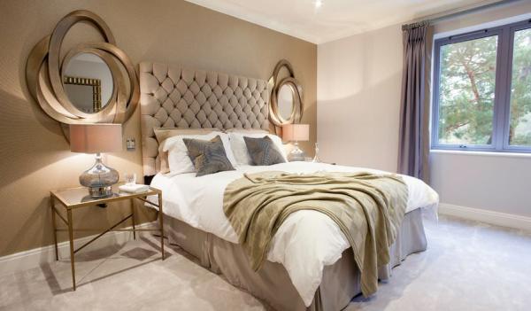Luxury-golden-bedroom-with-tuftead-headboard