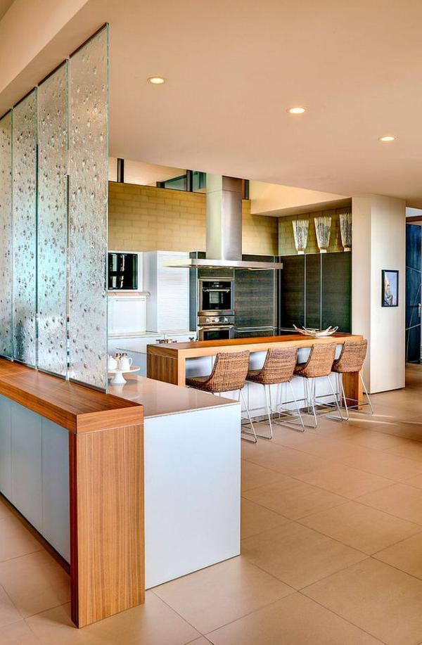 Translucent-glass-panes-create-a-cool-partition-between-the-living-area-and-kitchen