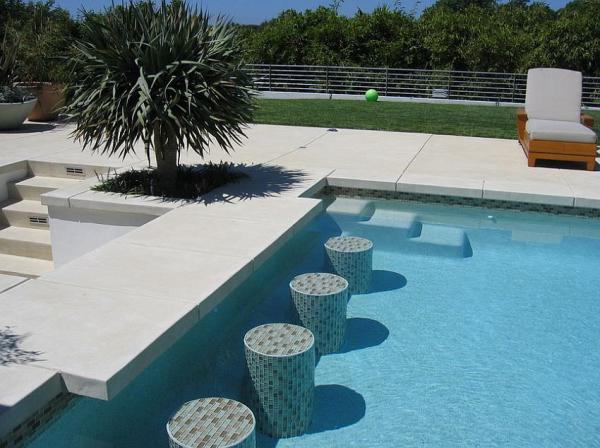 Acid-etch-finish-concrete-shapes-this-elegant-pool-deck-and-additional-features