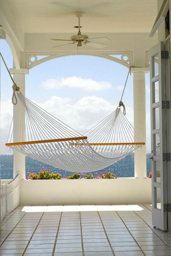 Beach-style-porch-with-hammock-overlooking-the-ocean