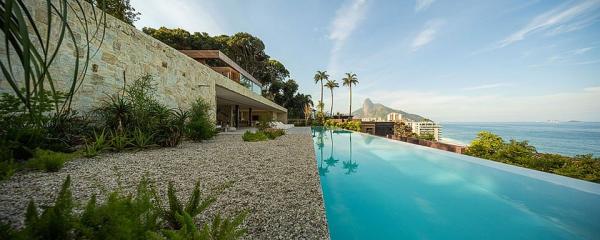 Beautiful-house-in-Brazil-with-a-lavish-pool-overlooks-the-ocean-in-the-distance