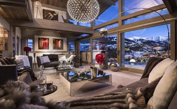 Bright-pops-of-red-and-view-of-snow-covered-Alps-enliven-the-living-space