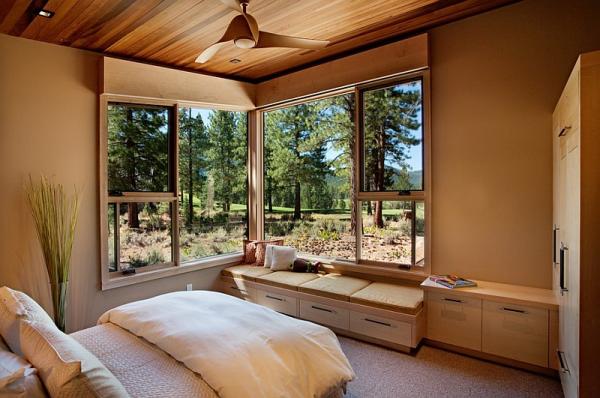 Cozy-daybed-in-the-corner-next-to-the-stylish-corner-window-of-the-bedroom