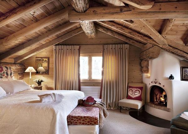 Exposed-wooden-beams-and-a-rustic-cabin-look-inside-the-bedroom