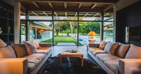 Glass-doors-and-windows-connect-the-living-area-with-the-backyard
