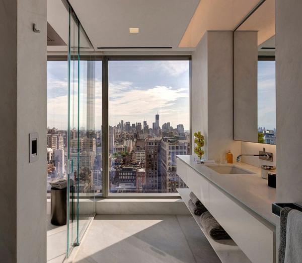 Glass-walls-separate-the-bedroom-from-the-bathroom