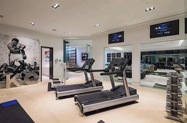 Home-gym-with-a-wall-mural-of-Ali