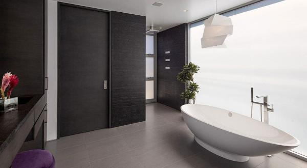 Lighting-fixture-color-palette-and-the-potted-plant-give-the-master-bathroom-an-oreintal-appeal