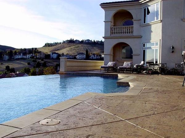 Mediterranean-style-pool-area-with-stamped-concrete-deck