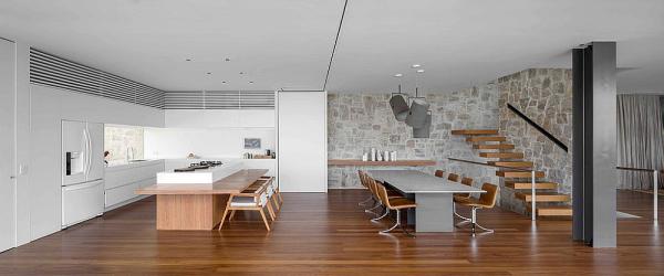 Modern-dining-room-and-kitchen-with-a-stone-backdrop