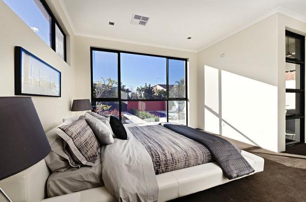 Serene-and-elegant-bedroom-in-white-with-a-viusally-connectivity-with-the-outdoors