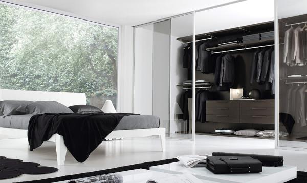 Sleek-and-stylish-bedroom-in-black-and-white-with-a-walk-in-closet