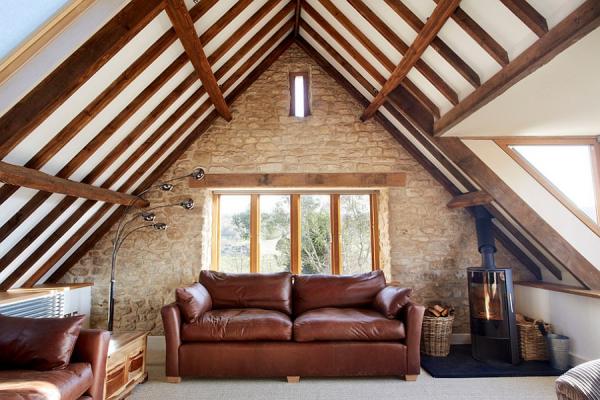 Snug-attic-living-room-of-a-renovated-old-barn