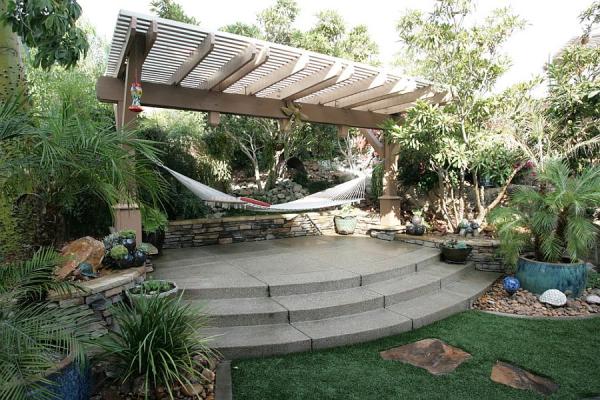 Tropical-style-landscape-with-pergola-and-hammock
