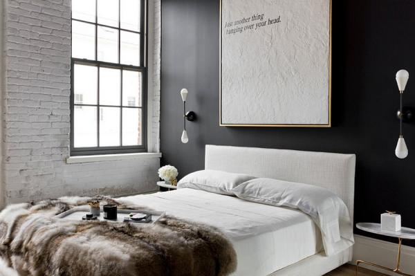 White-brick-and-dark-accent-wall-add-contrast-to-the-NYC-apartment-bedroom