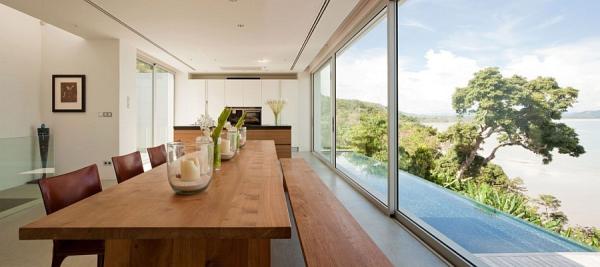 Wooden-dining-table-complements-the-sleek-wooden-deck-outside