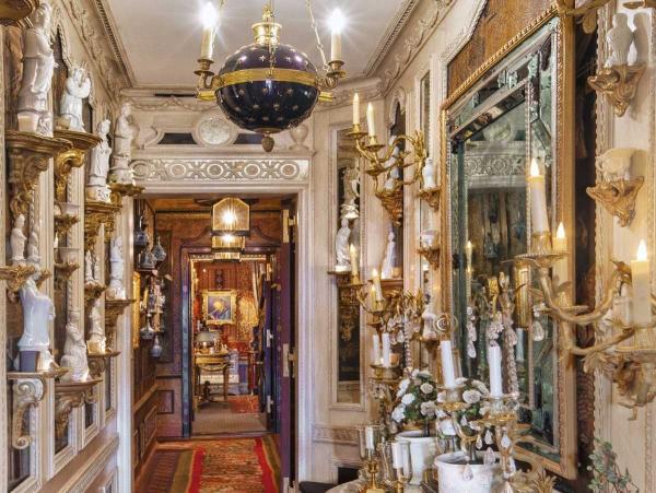 carved-and-gilded-moldings-are-featured-throughout-the-apartment