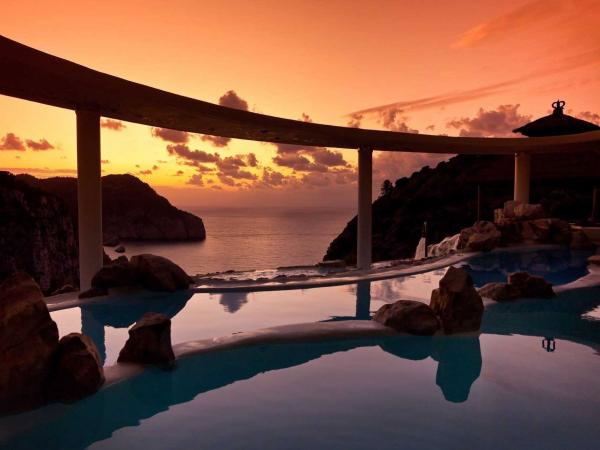 the-hotel-haciende-na-xamena-resort-in-ibiza-spain-is-suspended-180-meters-at-the-top-of-a-cliff-to-offer-amazing-panoramic-mountain-and-sea-views