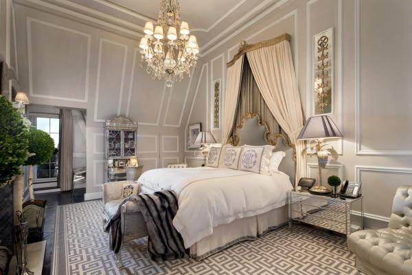 the-master-bedroom-has-a-more-neutral-palette-but-the-same-lavish-decor